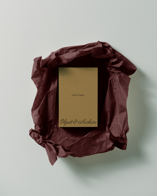 Gift card in a brown envelope on a light gray background